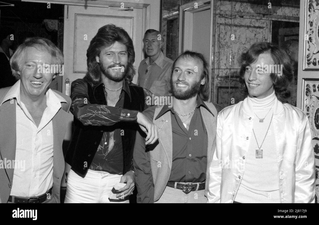 Robert Stigwood with Barry Gibb, Maurice Gibb and Robin Gibb of The Bee Gees at a press conference promoting the film, Sgt. Pepper's Lonely Hearts Club Band at the Beverly Wilshire Hotel, Beverly Hills, California. July 1978 Credit: Ralph Dominguez/MediaPunch Stock Photo