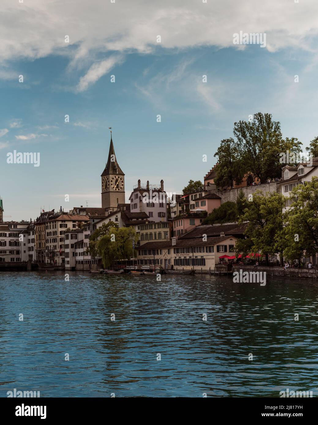 Zurich Switzerland. 7. July 2018 St. Peter's church clock tower in Zurich viewed from the river Limmat Stock Photo