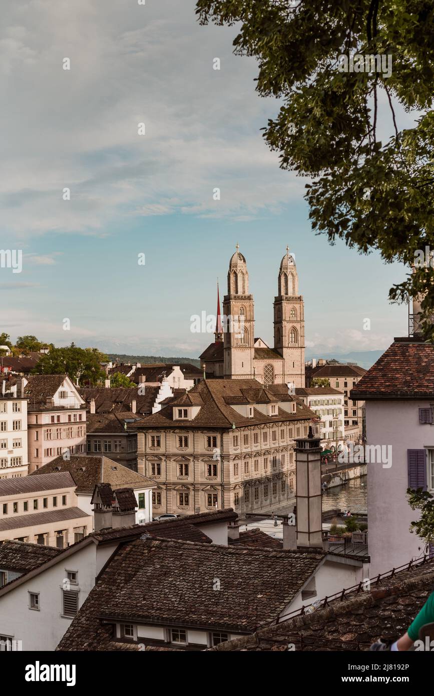 View of historic Zurich city center with famous Grossmunster Church from Lindenhof park, Zurich, Switzerland Stock Photo