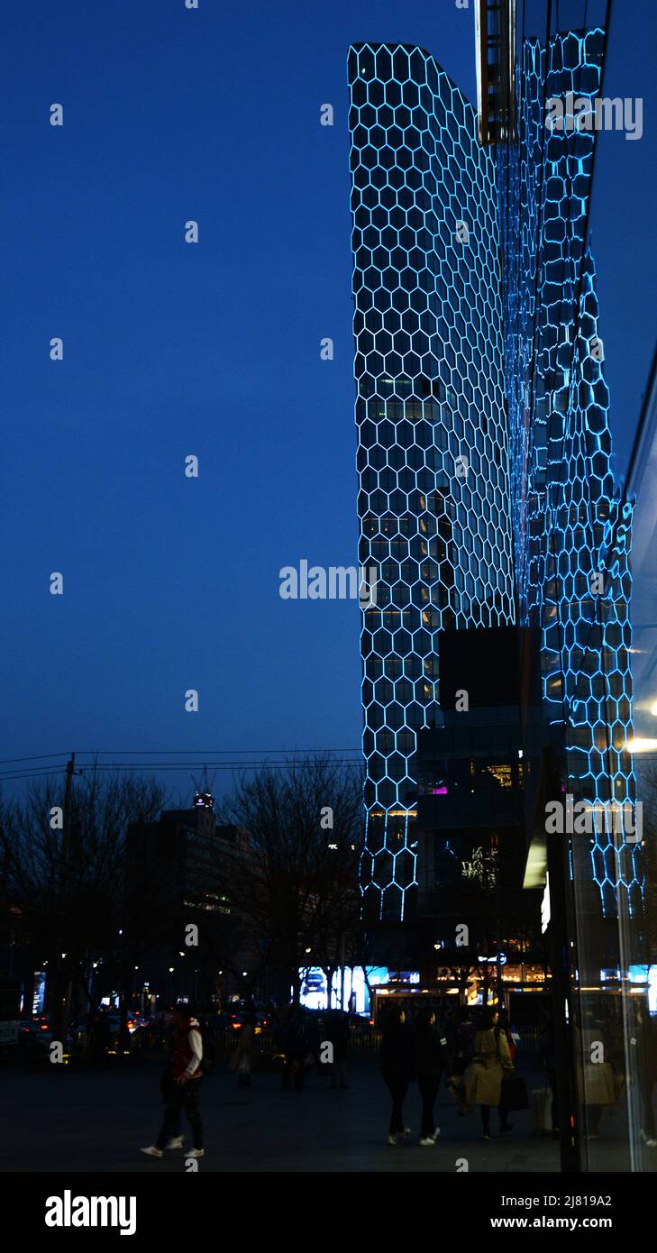 The Intercontinental Sanlitun Tongying Center hotel illuminated at night. Beijing, China. Stock Photo