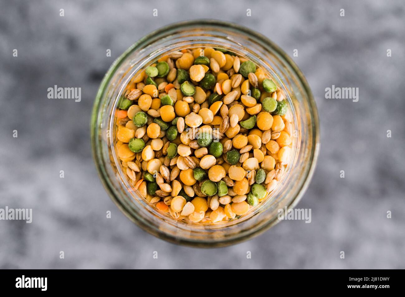 spice jar with lentil and bean soup mix closeup shot of pantry ingredients, concept of simple
