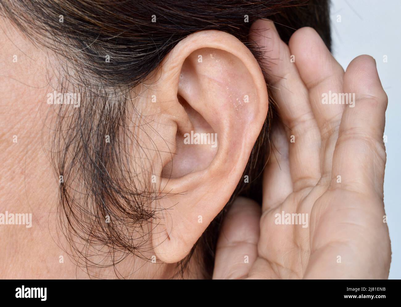 Ear of Asian old woman with deafness. Concept of keeping the ears open. Stock Photo