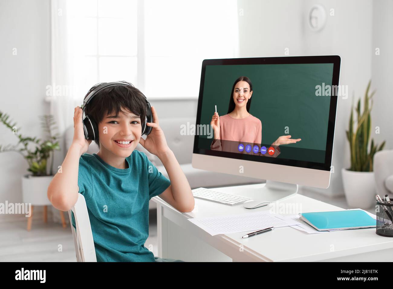 Little boy using computer to study online at home Stock Photo