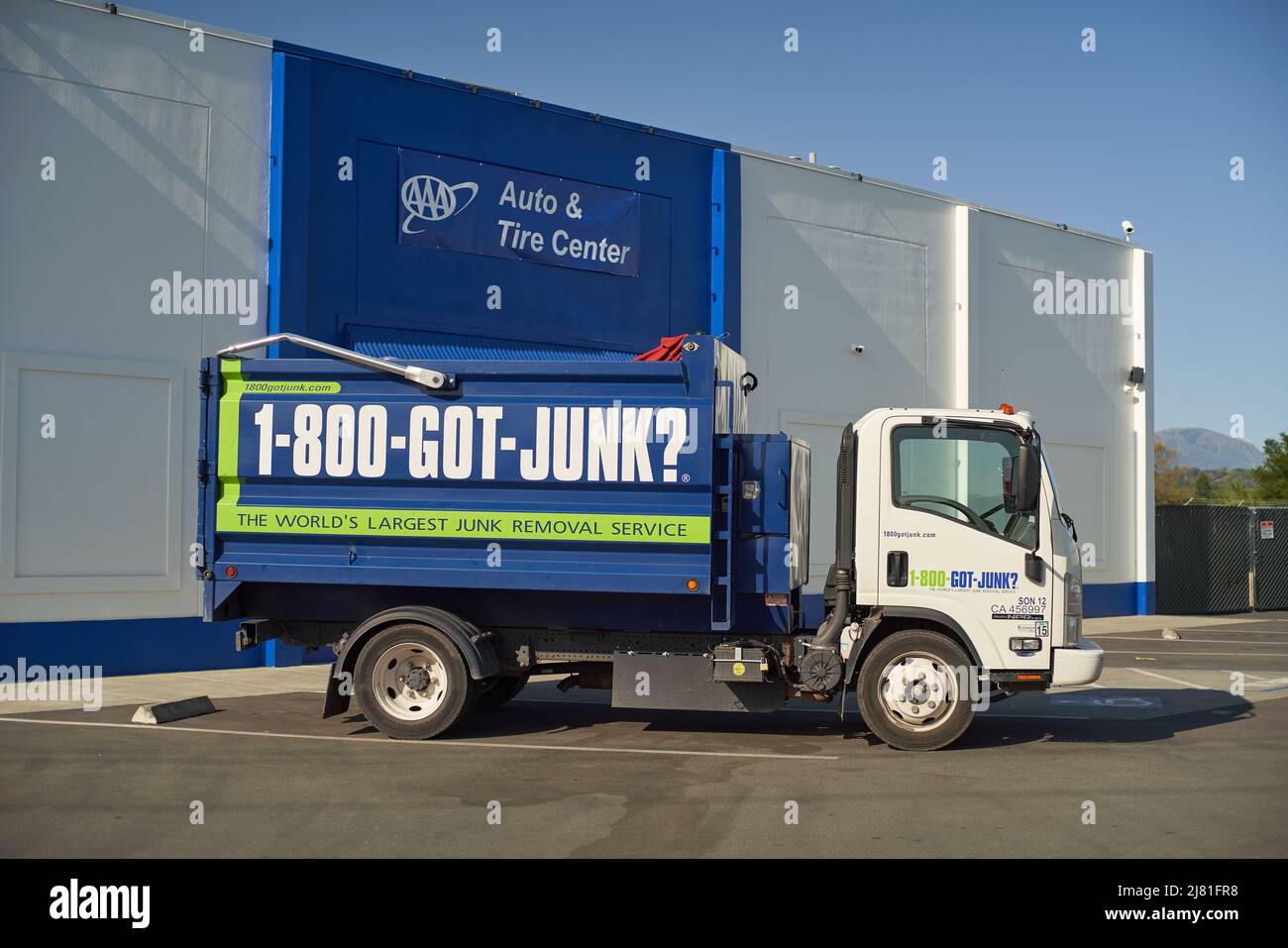 1-800-GOT-JUNK? truck parked outside of AAA Auto & Tire Service in Windsor, California. Stock Photo