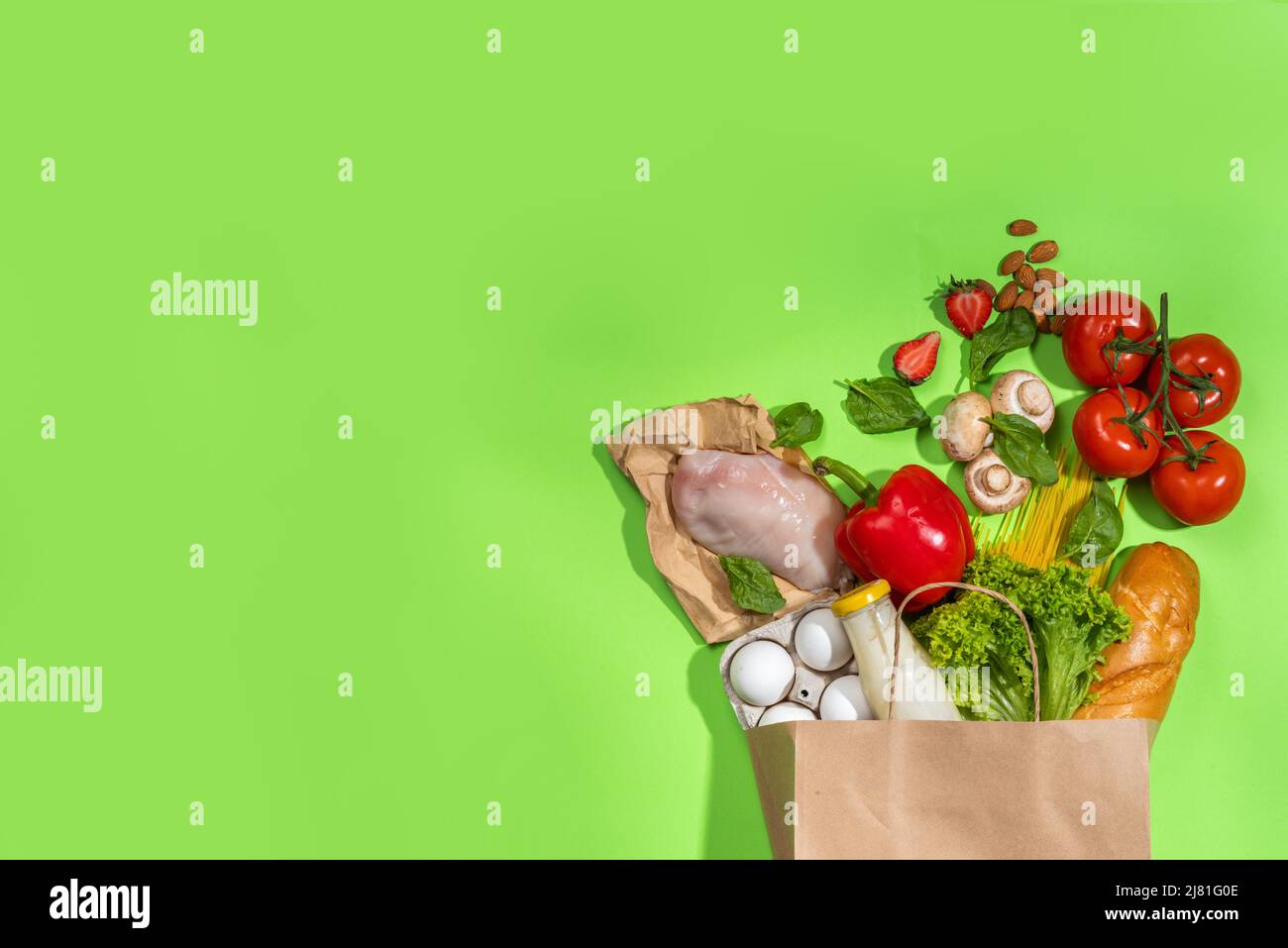 Fresh vegetables, meat, bread fruits in paper grocery bag. Delivery