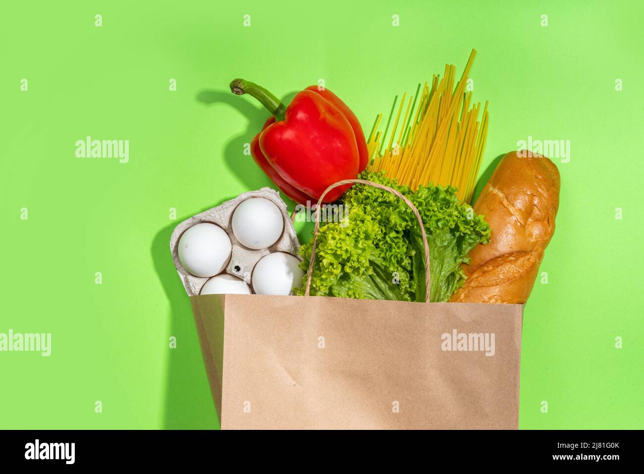 Fresh vegetables, meat, bread fruits in paper grocery bag. Delivery