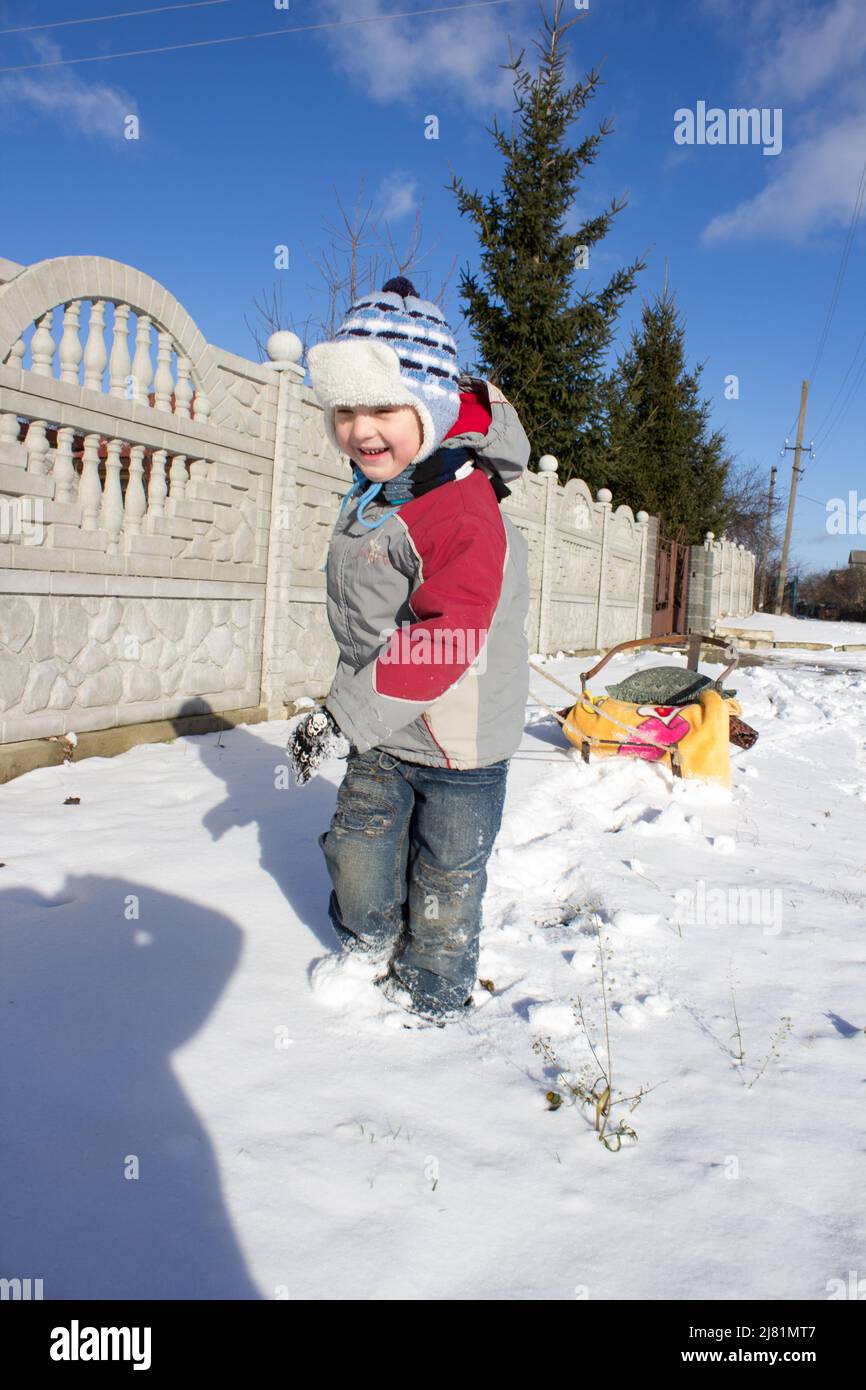 boy pulling sled Stock Photo