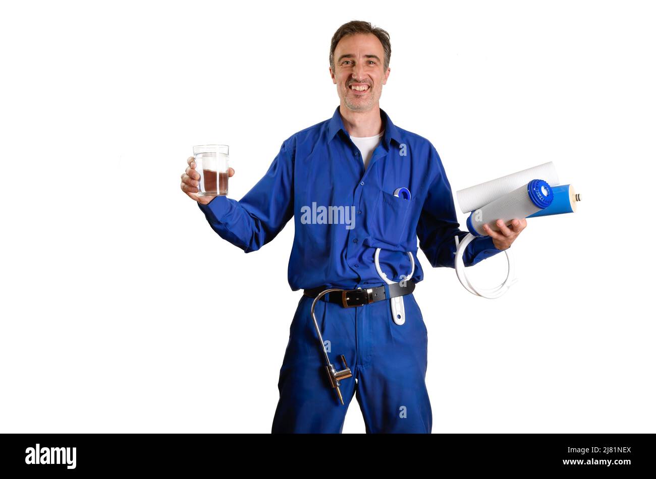 Water treatment technician showing glass of purified water with filters
