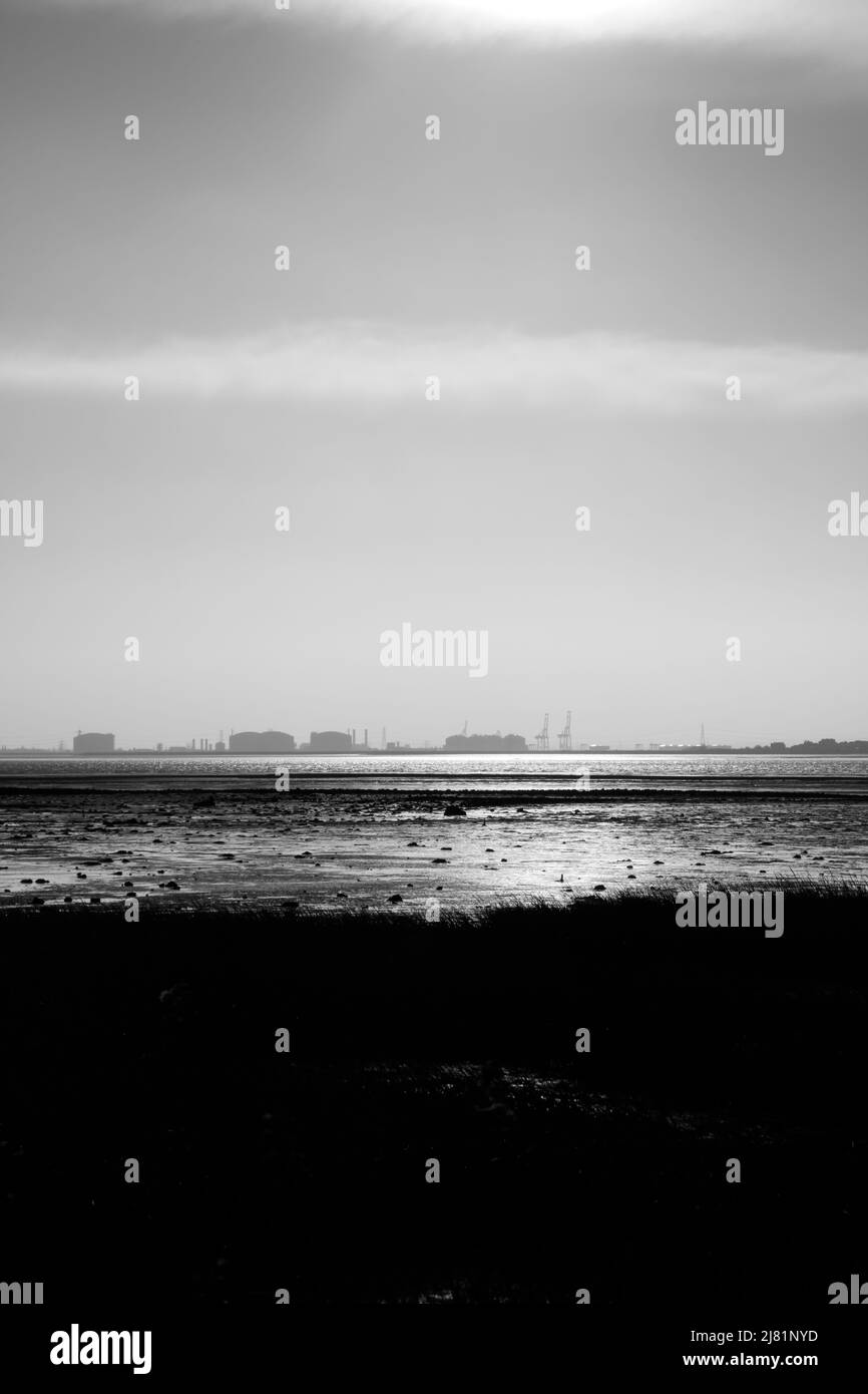 View across the Thames Estuary from Canvey Island to the Hoo Peninsula and Isle of Grain, Kent, England, UK Stock Photo
