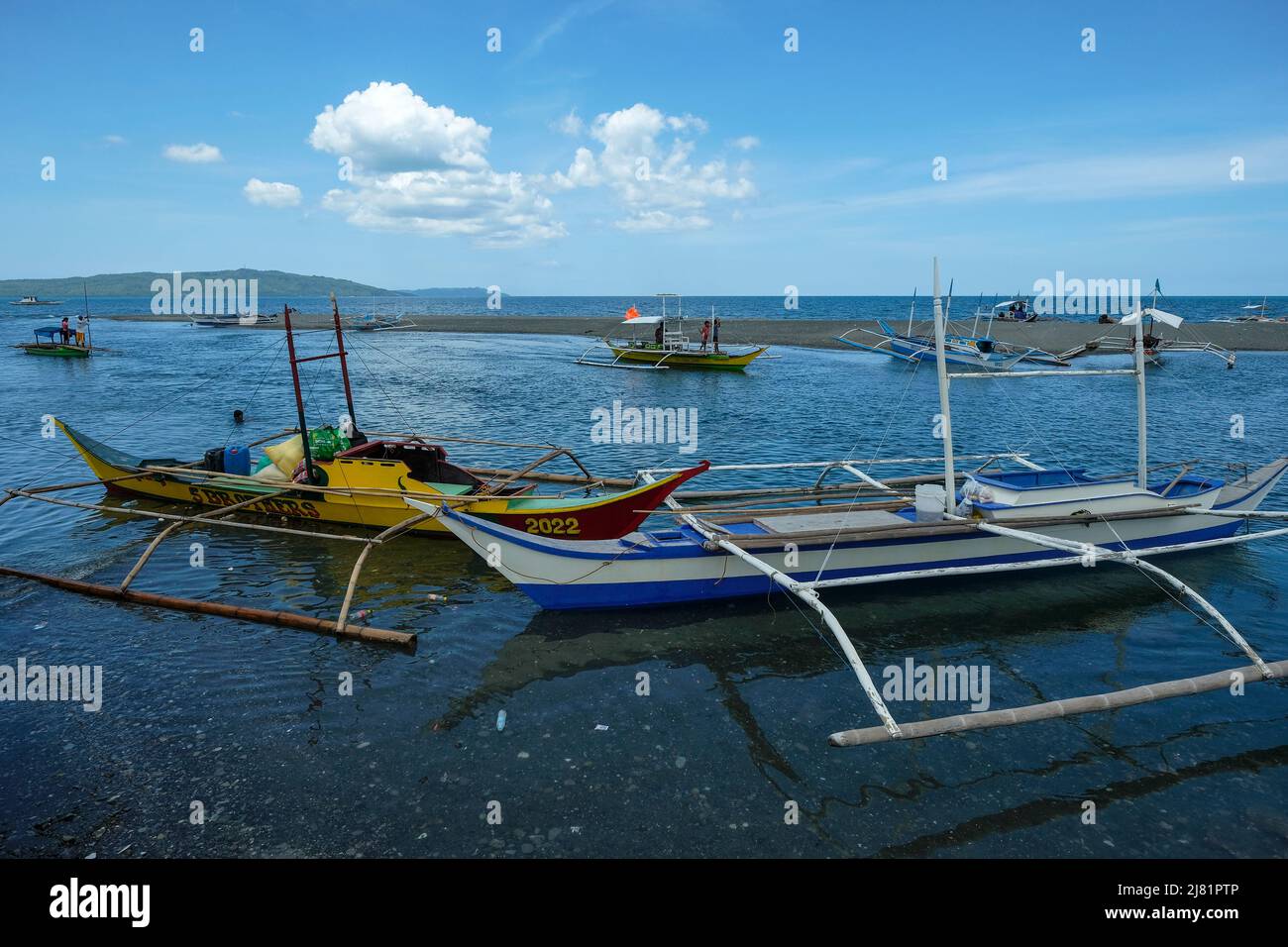 San Jose, Philippines - May 2022: Fishing boats on the beach of San Jose on May 3, 2022 in San Jose, Occidental Mindoro, Philippines. Stock Photo