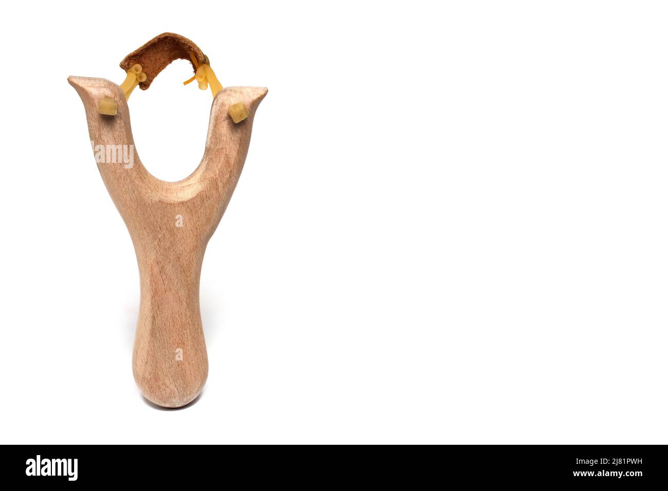 scary frontal view of wooden slingshot ready to fire against white