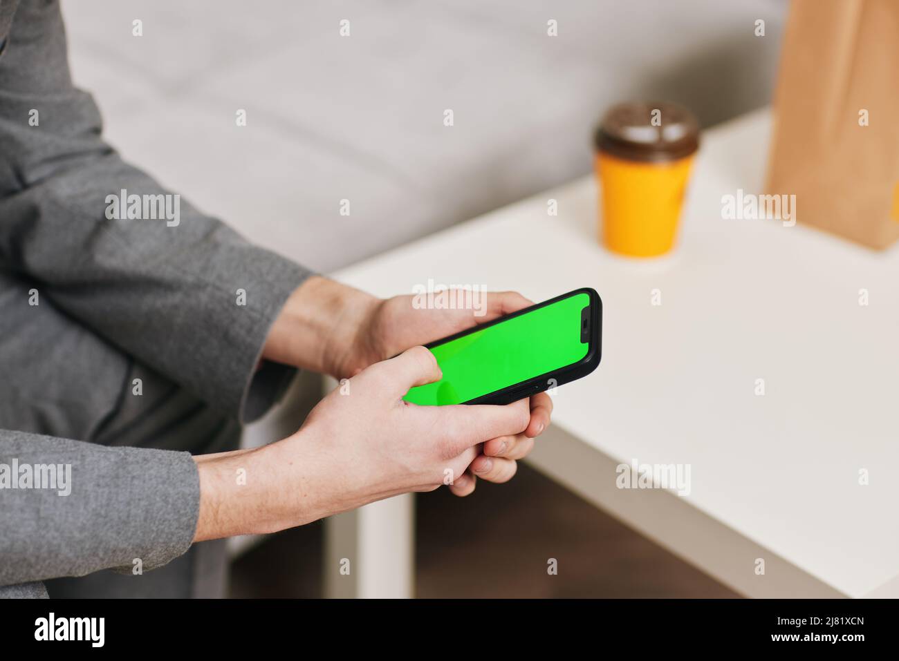 Phone green screen office hand hi-res stock photography and images - Alamy