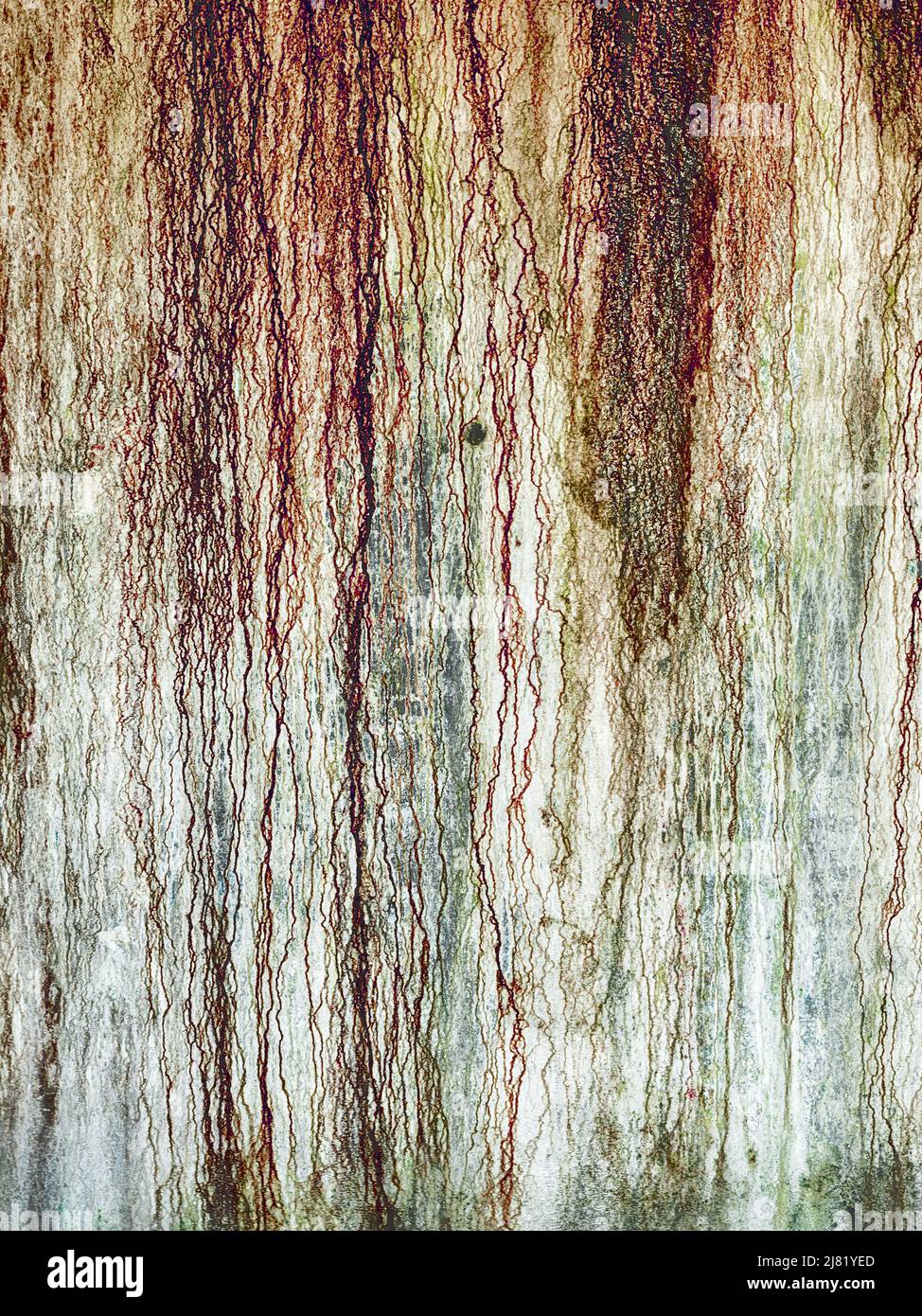 Rust stains from dripping water result in an abstract background pattern that looks like bloodstains. Stock Photo