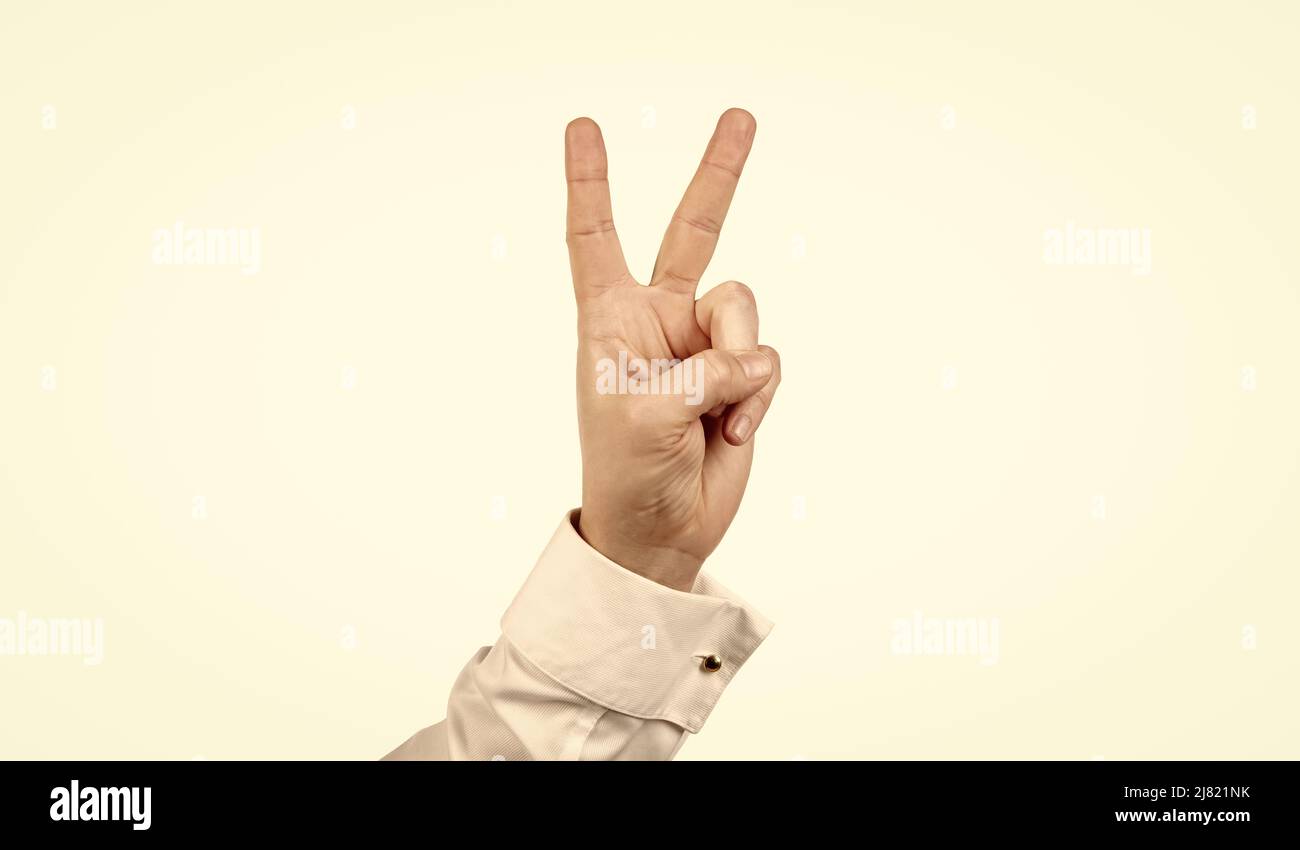 peace gesture of male hand isolated on white background, gesturing Stock Photo