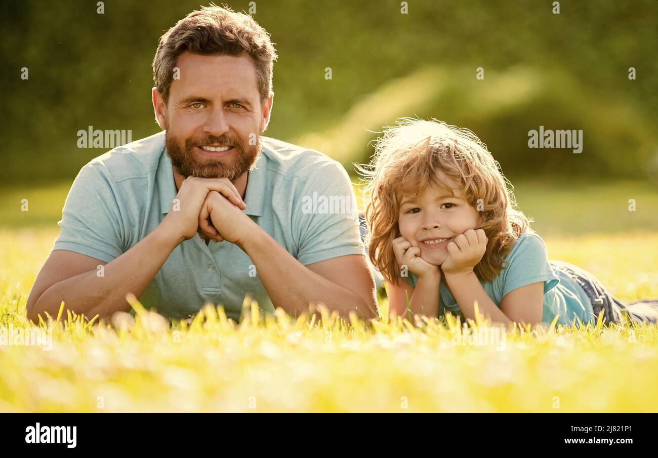 smiling father and son having fun in park. family value. childhood and parenthood. Stock Photo