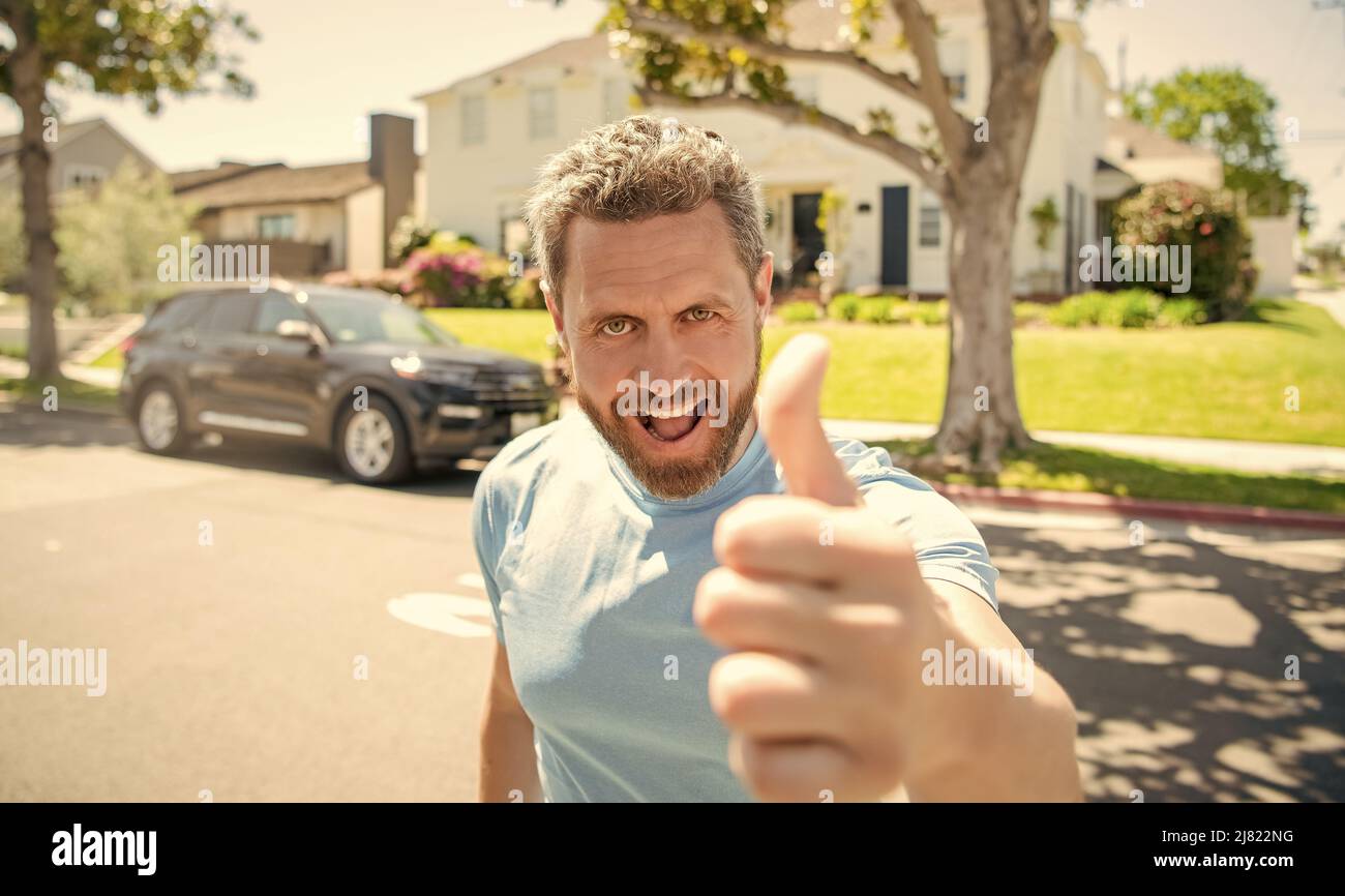 happy bearded man showing thumb up, approved Stock Photo