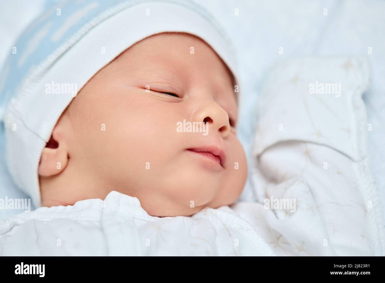 adorable new born baby sleeping in bed Stock Photo Alamy