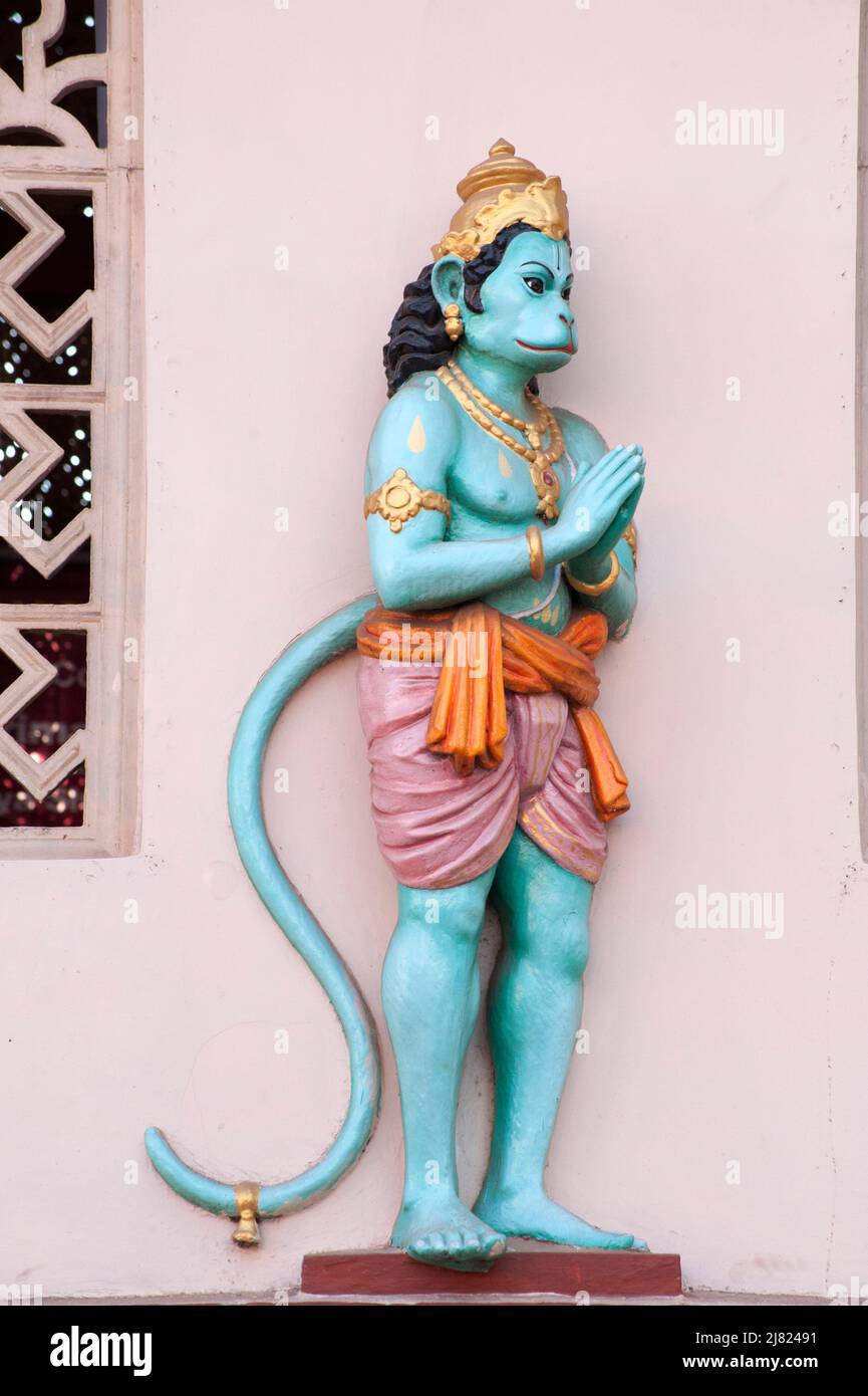 Statue of Hindu God Hanuman on the wall of temple at Mangalore state Karnataka India 02 05 2010 Stock Photo