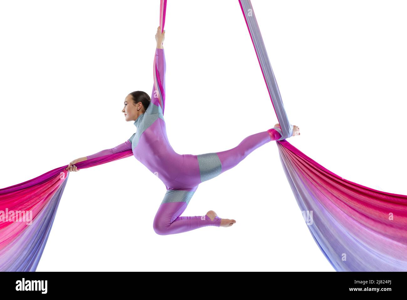Portrait of young woman, air gymnast training performing on colorful ...