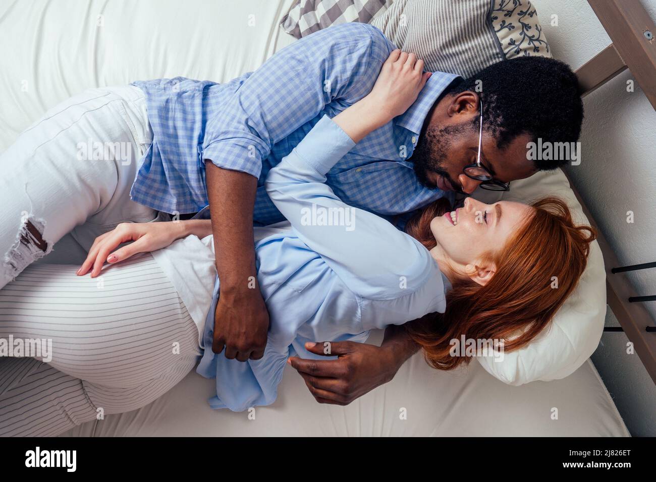 redhaired ginger caucasian happy female and multiethnic afro man
