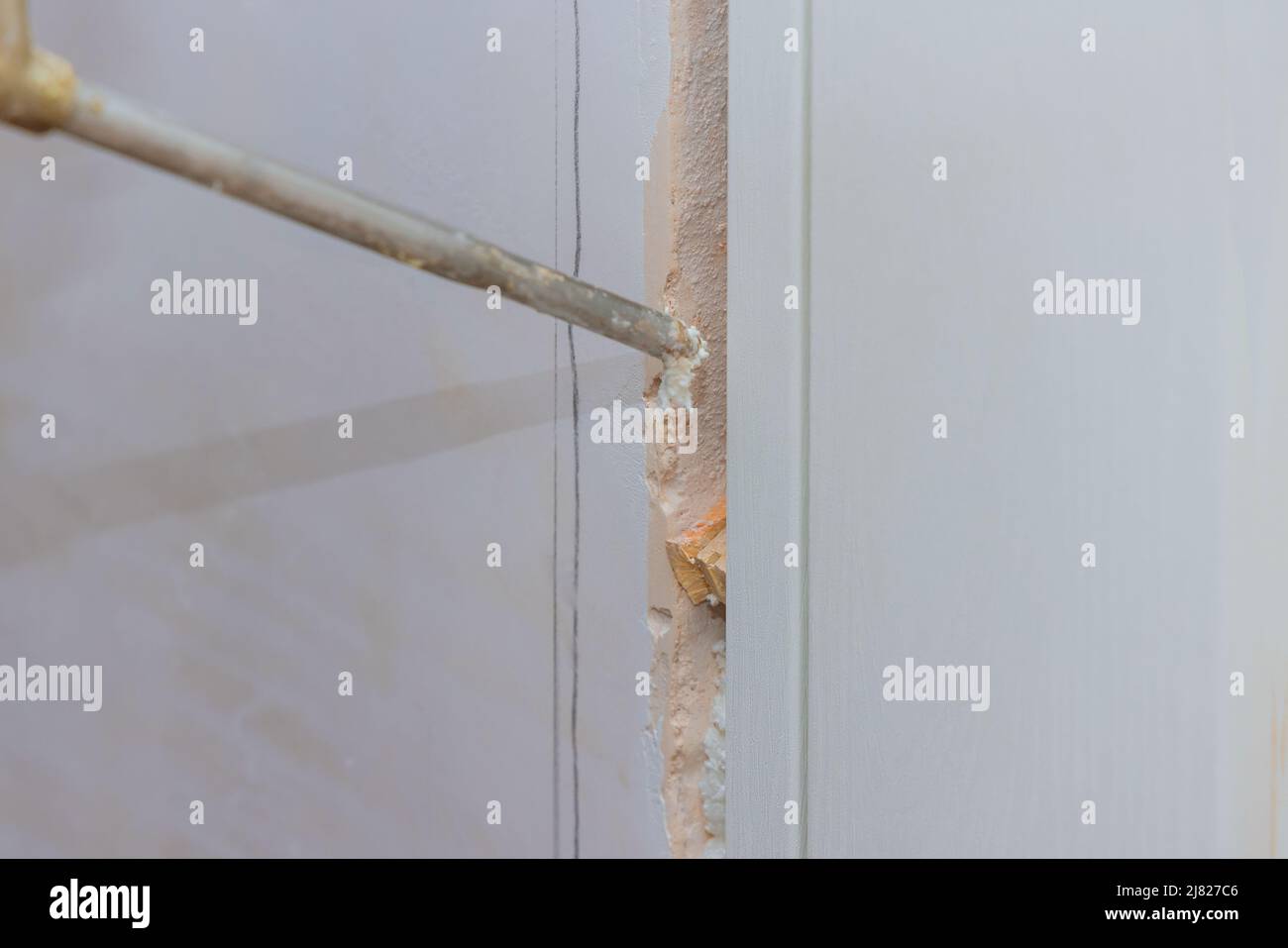 Door installation of doors using polyurethane foam mounting Stock Photo