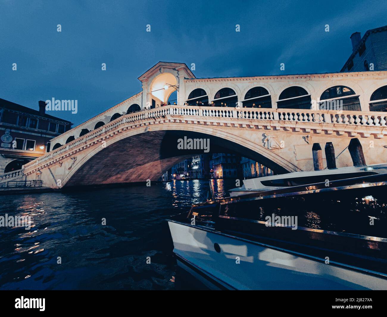 Rialto Bridge in Venice, Italy at night Stock Photo