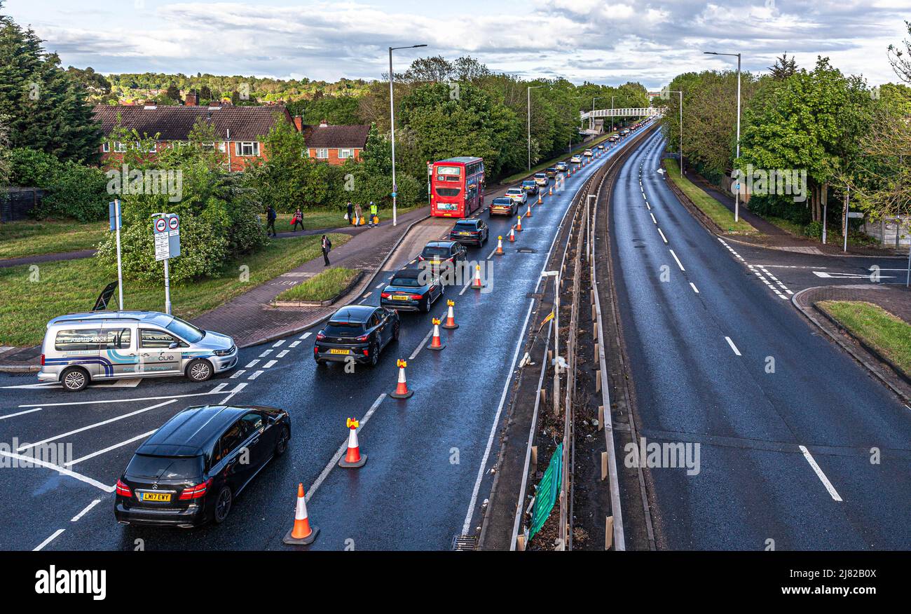 Long line of vehicles stuck in traffic on the A41 into Apex Corner, Edgware Way, England, UK. Stock Photo