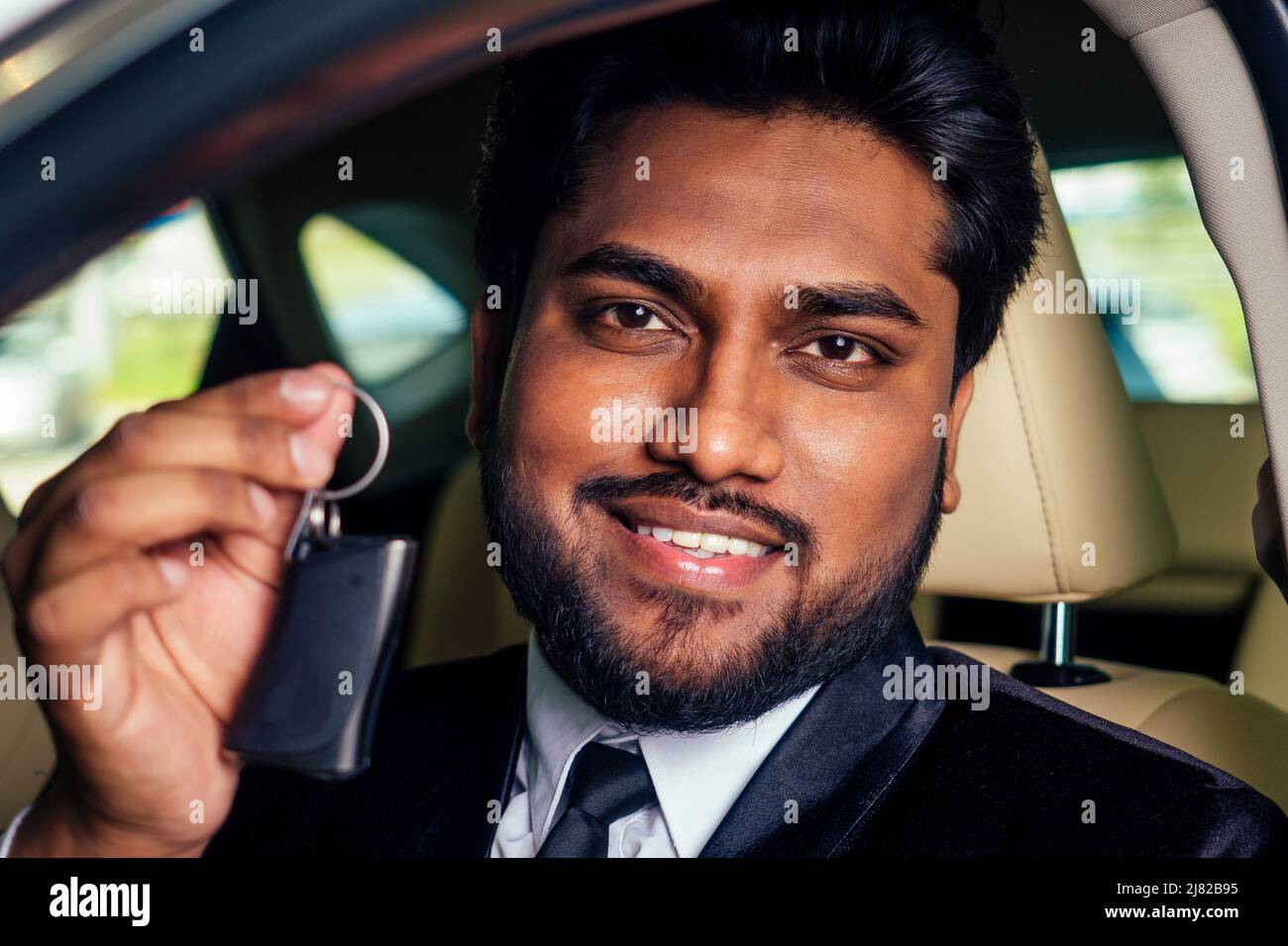 indian cheerful car salesman showing new keys showroom Stock Photo Alamy