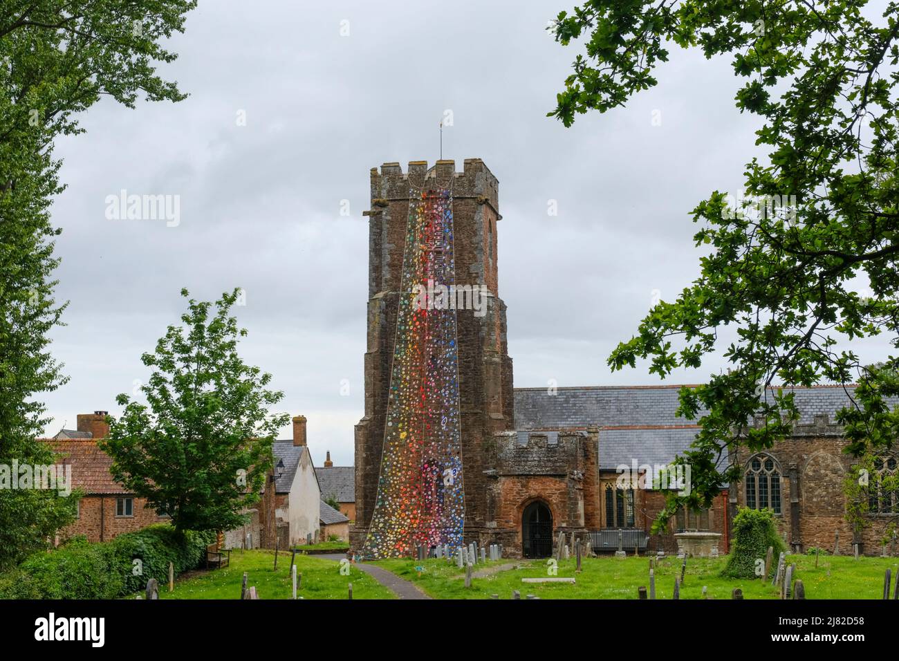 Stogumber, Somerset, UK. 12th May, 2022. Local people have decorated St Mary's Church tower in Stogumber with a cascade of flowers to celebrate the Queens Platinum jubilee. Credit: JMF News/Alamy Live News Stock Photo