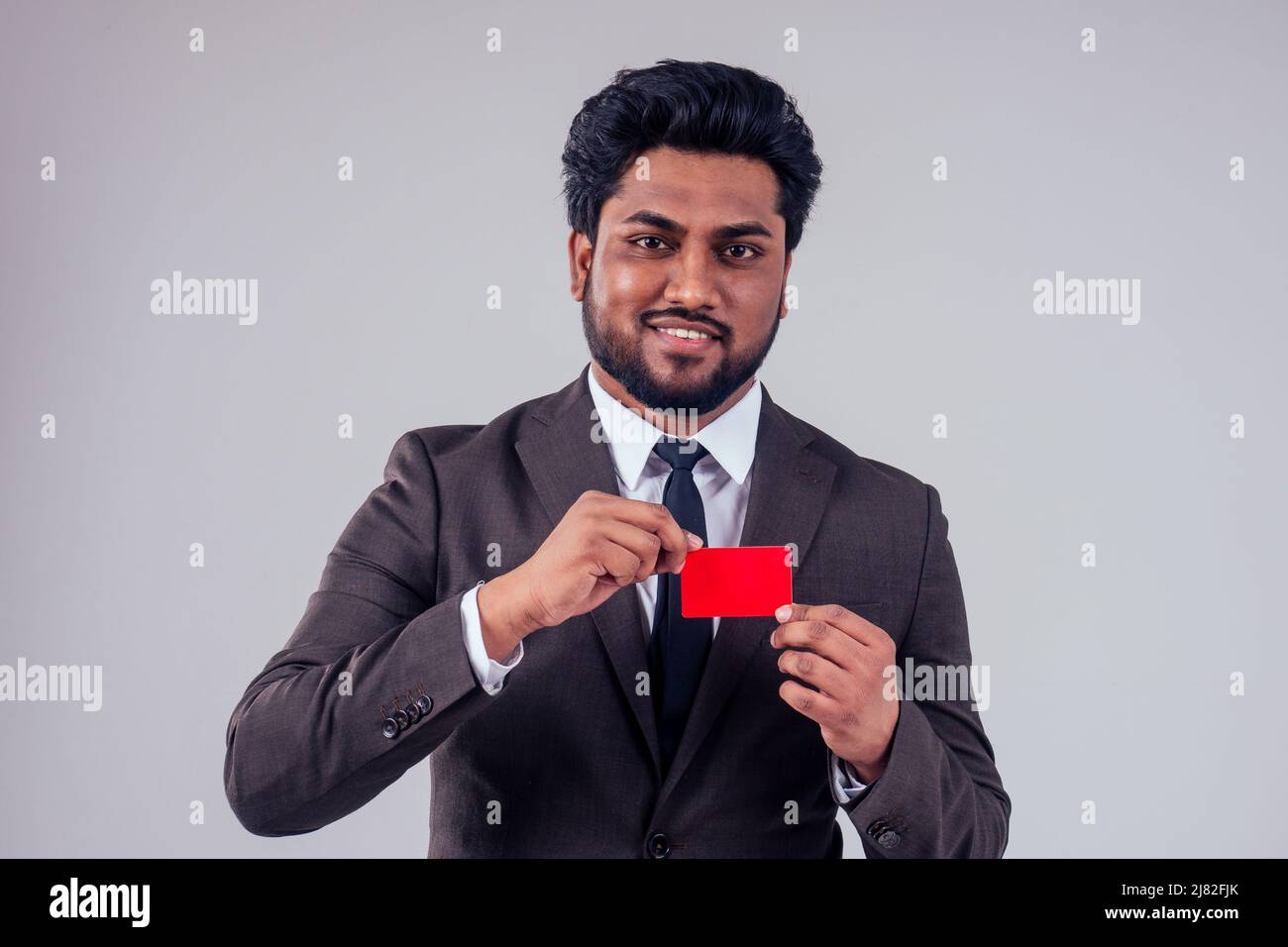 indian business man with credit card at studio white background,black ...