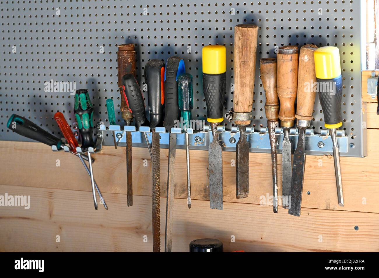 tool board with chisels and screwdrivers in workshop Stock Photo