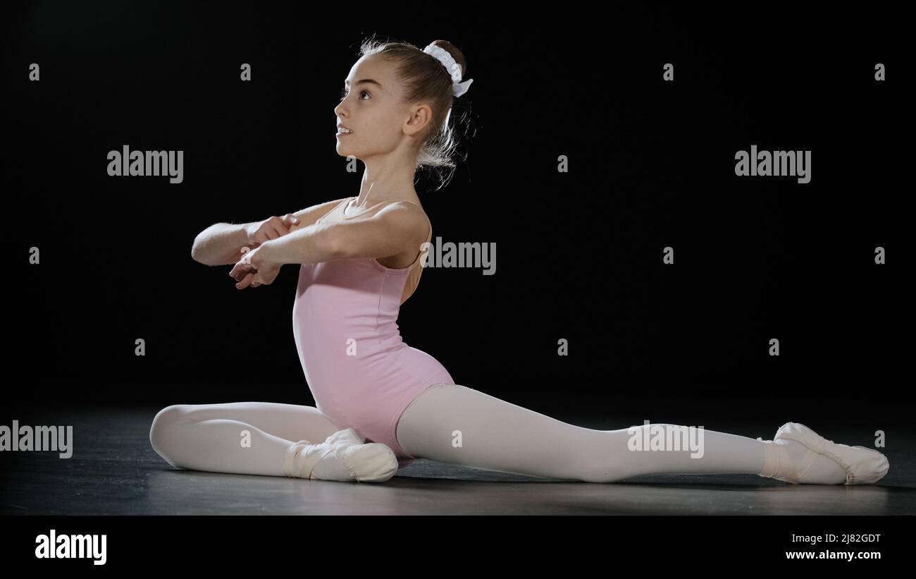 Teen girl child kid teenager gymnast doing backbend exercises in dance ...