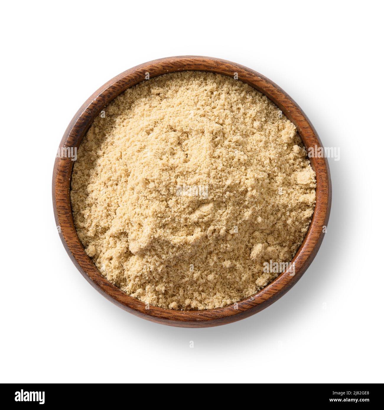 Sesame flour in wooden bowl on white background. View from above. Stock Photo