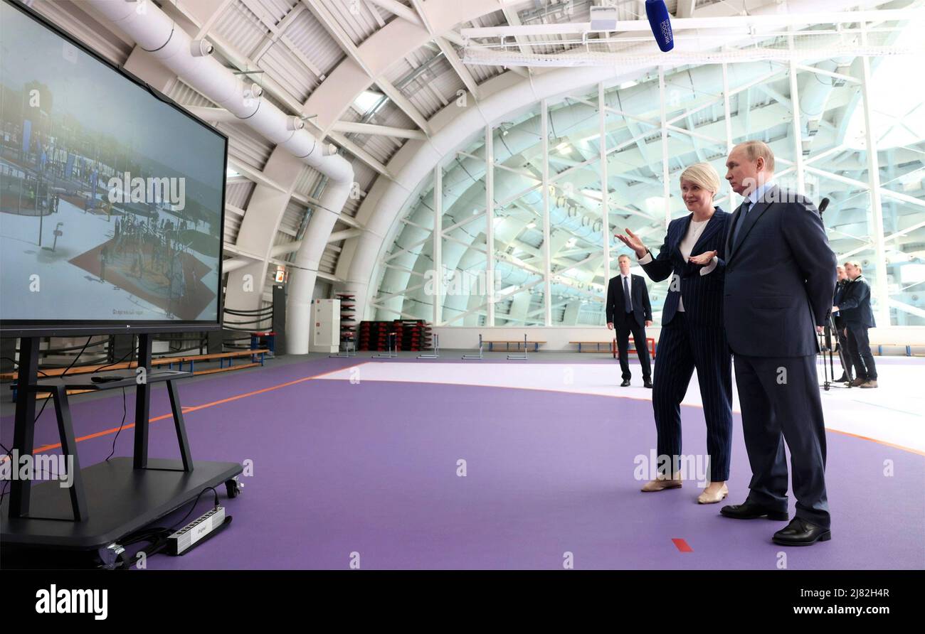 Sochi, Russia. 11th May, 2022. Russian President Vladimir Putin Before is given a tour of the new sports facilities of the Sirius Educational Centre by foundation director Yelena Shmeleva, before a meeting of the Board of Trustees, May 11, 2022 in Sochi, Russia. Credit: Mikhail Metzel/Kremlin Pool/Alamy Live News Stock Photo