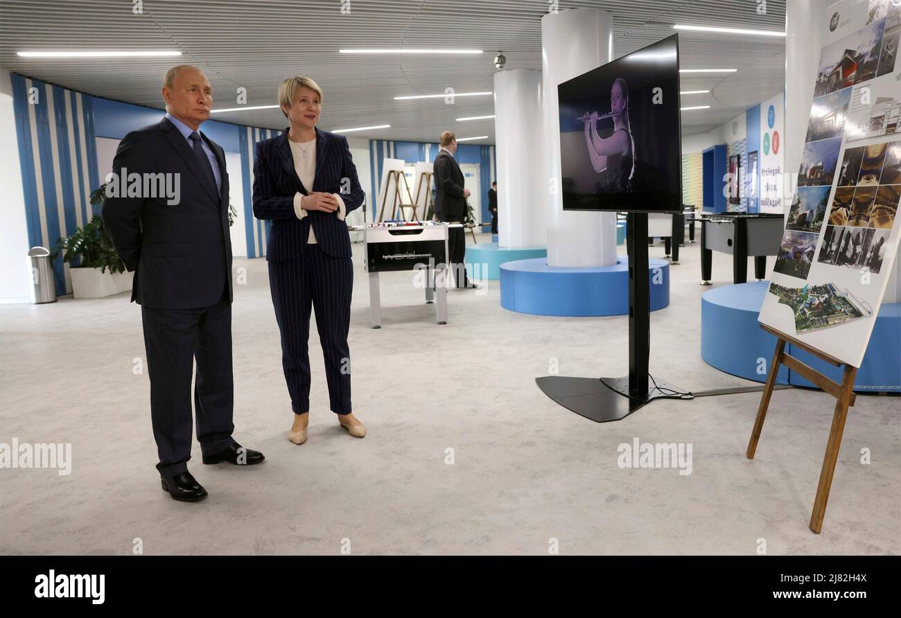 Sochi, Russia. 12th May, 2022. Russian President Vladimir Putin Before is given a tour of the new sports facilities of the Sirius Educational Centre by foundation director Yelena Shmeleva, before a meeting of the Board of Trustees, May 11, 2022 in Sochi, Russia. Credit: Mikhail Metzel/Kremlin Pool/Alamy Live News Stock Photo