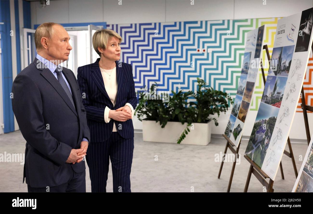 Sochi, Russia. 11th May, 2022. Russian President Vladimir Putin Before is given a tour of the new sports facilities of the Sirius Educational Centre by foundation director Yelena Shmeleva, right, before a meeting of the Board of Trustees, May 11, 2022 in Sochi, Russia. Credit: Mikhail Metzel/Kremlin Pool/Alamy Live News Stock Photo