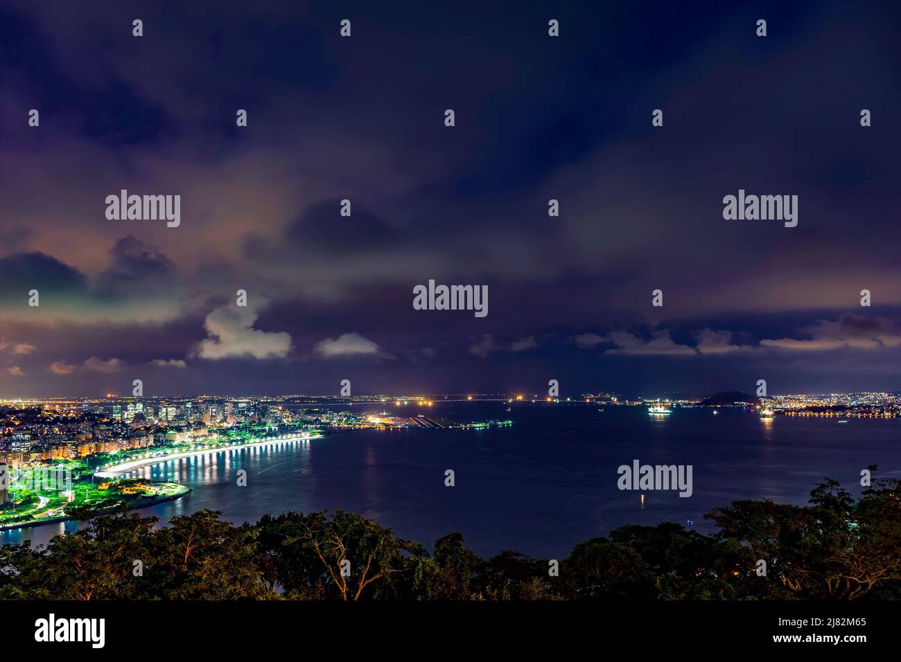 Night view of Rio de Janeiro downtown, Guanabara bay, Santos Dumont airport, Flamengo beach and the streets and buildings of city illuminateds Stock Photo