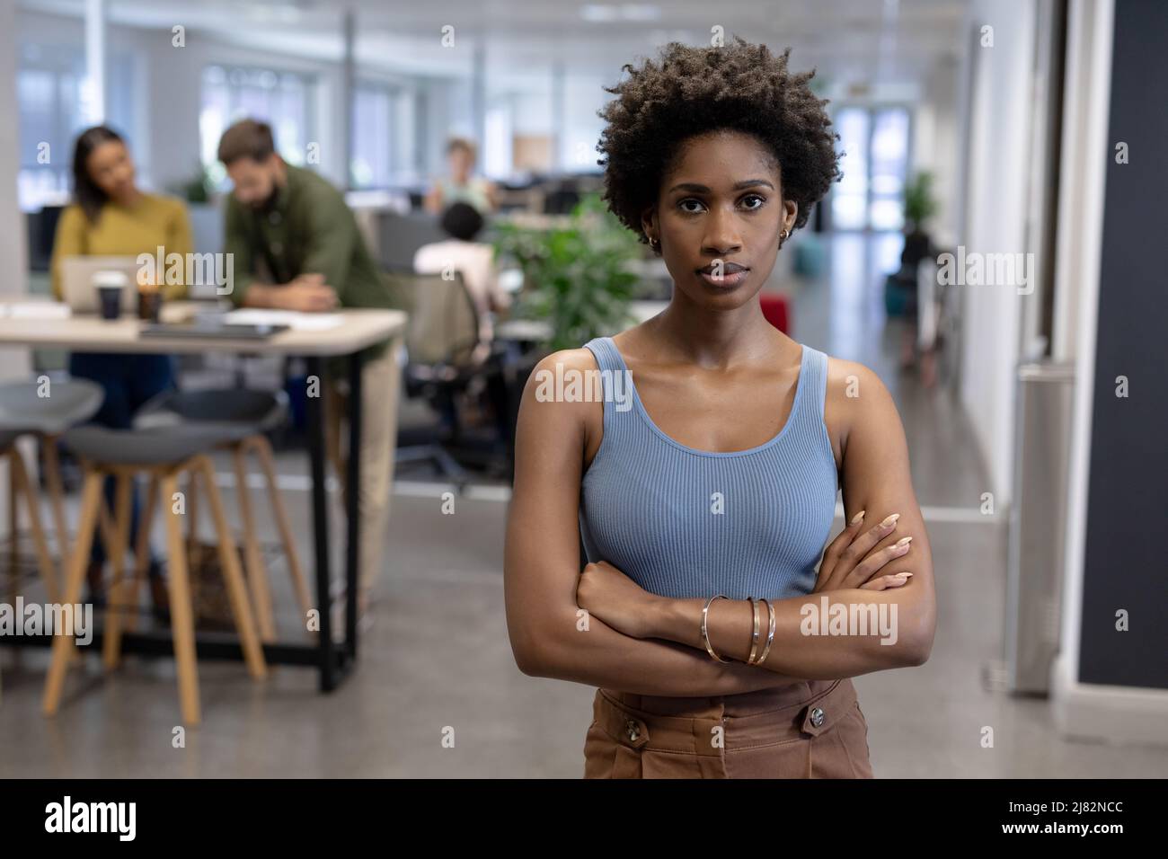 Portrait of confident young african american businesswoman standing ...