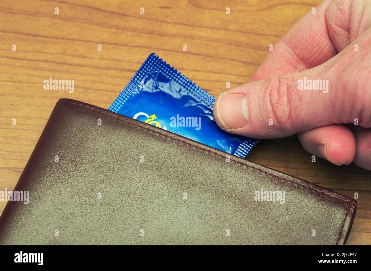 Wallet Condom Rings Condom and hand hi-res stock photography and images - Alamy