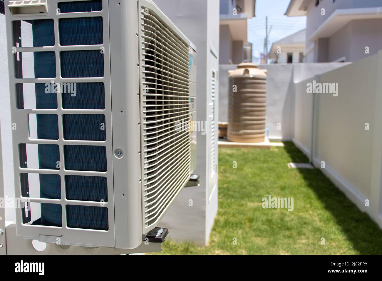Air conditioner compressor outdoor unit installed on a facade of the house Stock Photo Alamy