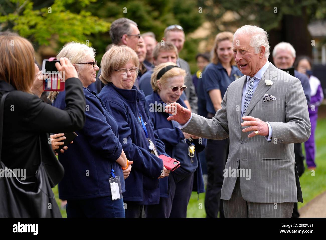 The Prince of Wales (right) meets staff and students as he arrives to open Trinity College's new Levine Building at Oxford University. Picture date: Thursday May 12, 2022. Stock Photo