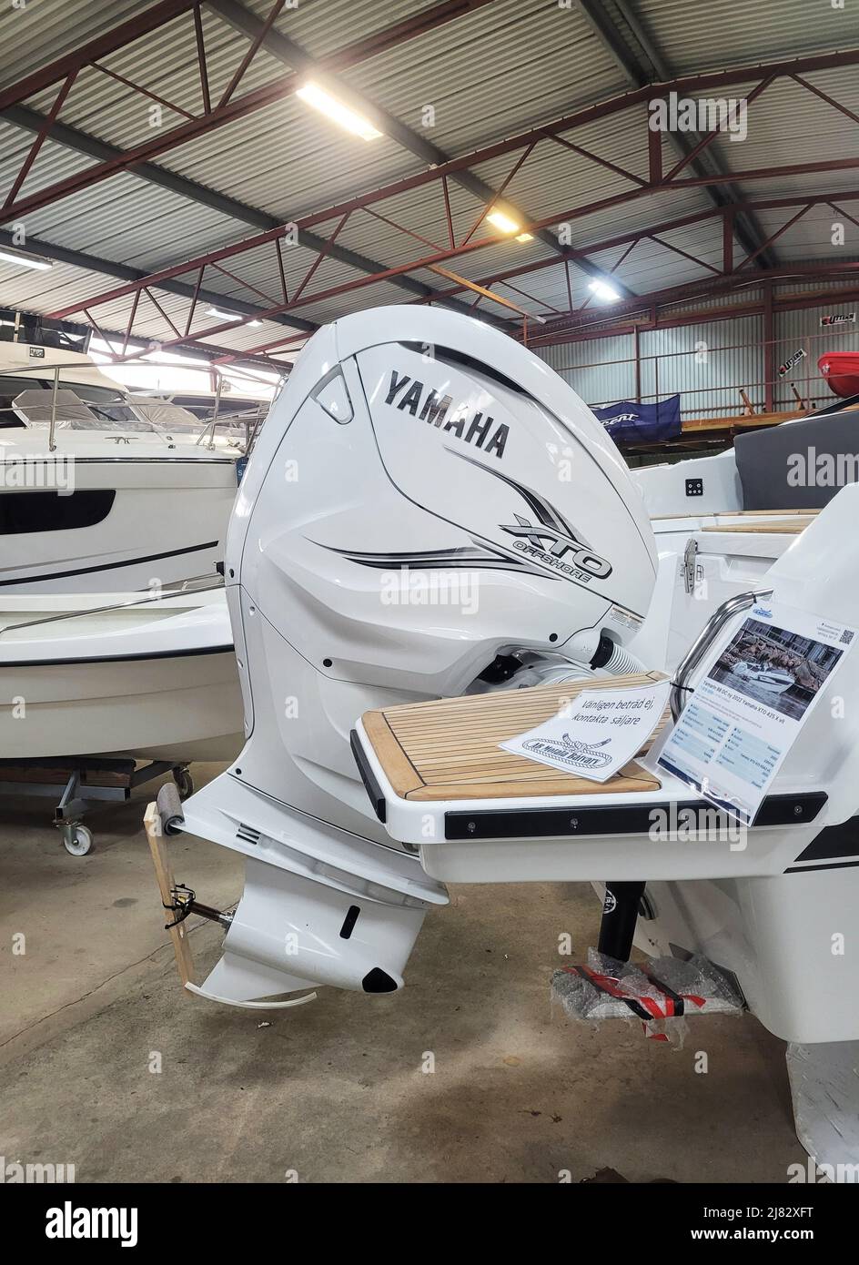 Boats and accessories for sale at a shipyard Stock Photo Alamy