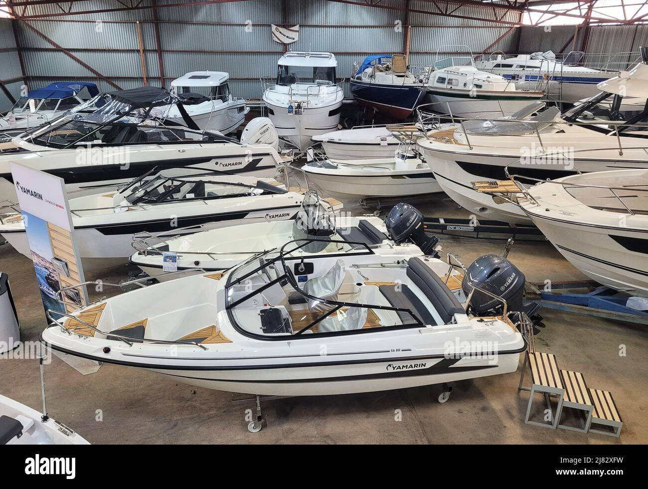 Boats and accessories for sale at a shipyard Stock Photo Alamy