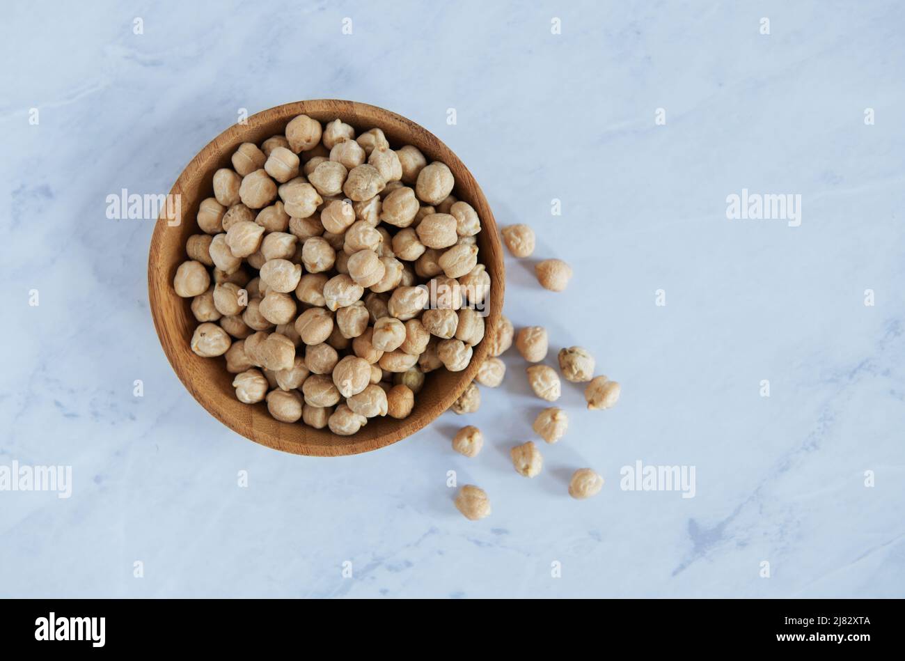 Wooden bowl with Garbanzo beans Stock Photo