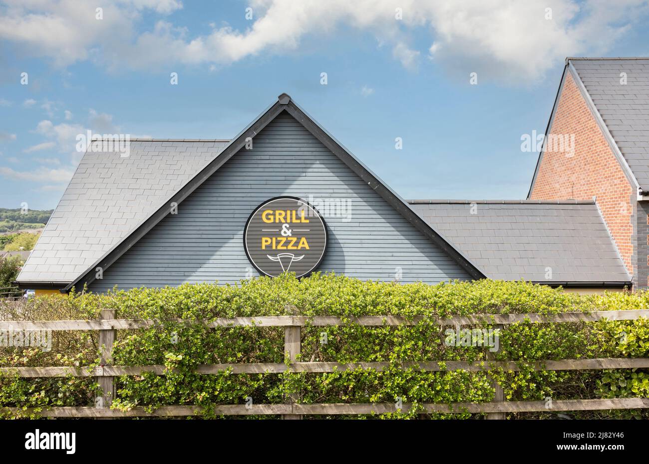 NewcastleunderLyme ,Staffordshireunited kingdom May, 12, 2022 yellow grill and pizza sign on