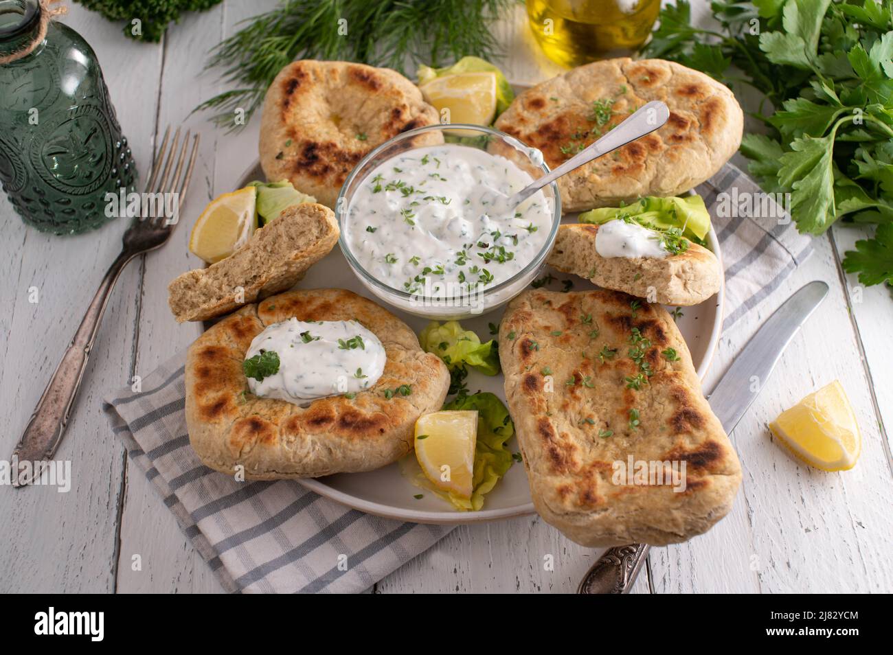 Homemade pan bread with yogurt, garlic, herb dip Stock Photo Alamy