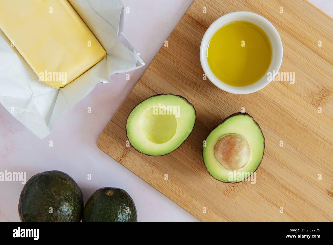 Still life of healthy fats including avocado, butter and olive oil Stock Photo Alamy