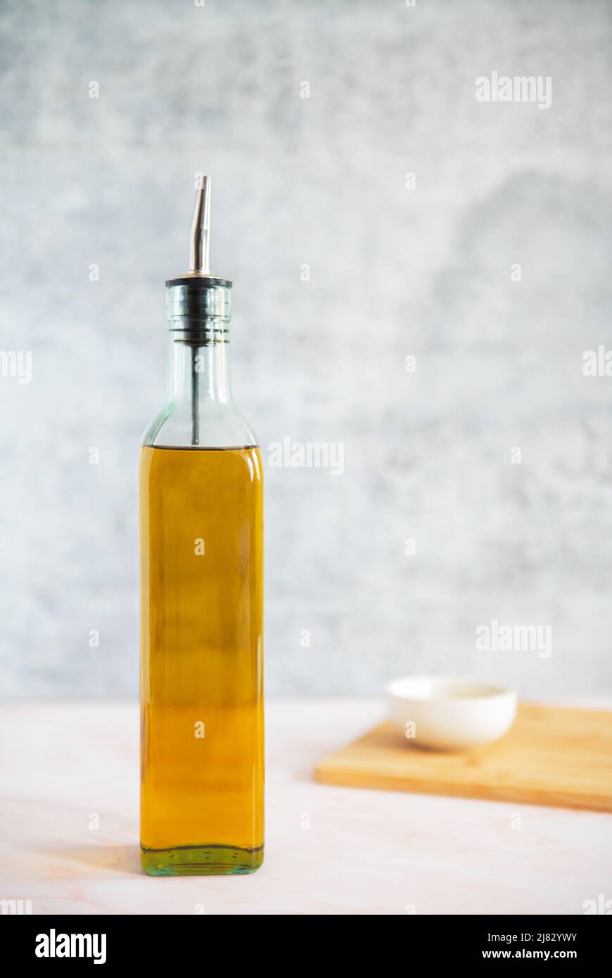 Decanter of olive oil in a kitchen setting Stock Photo
