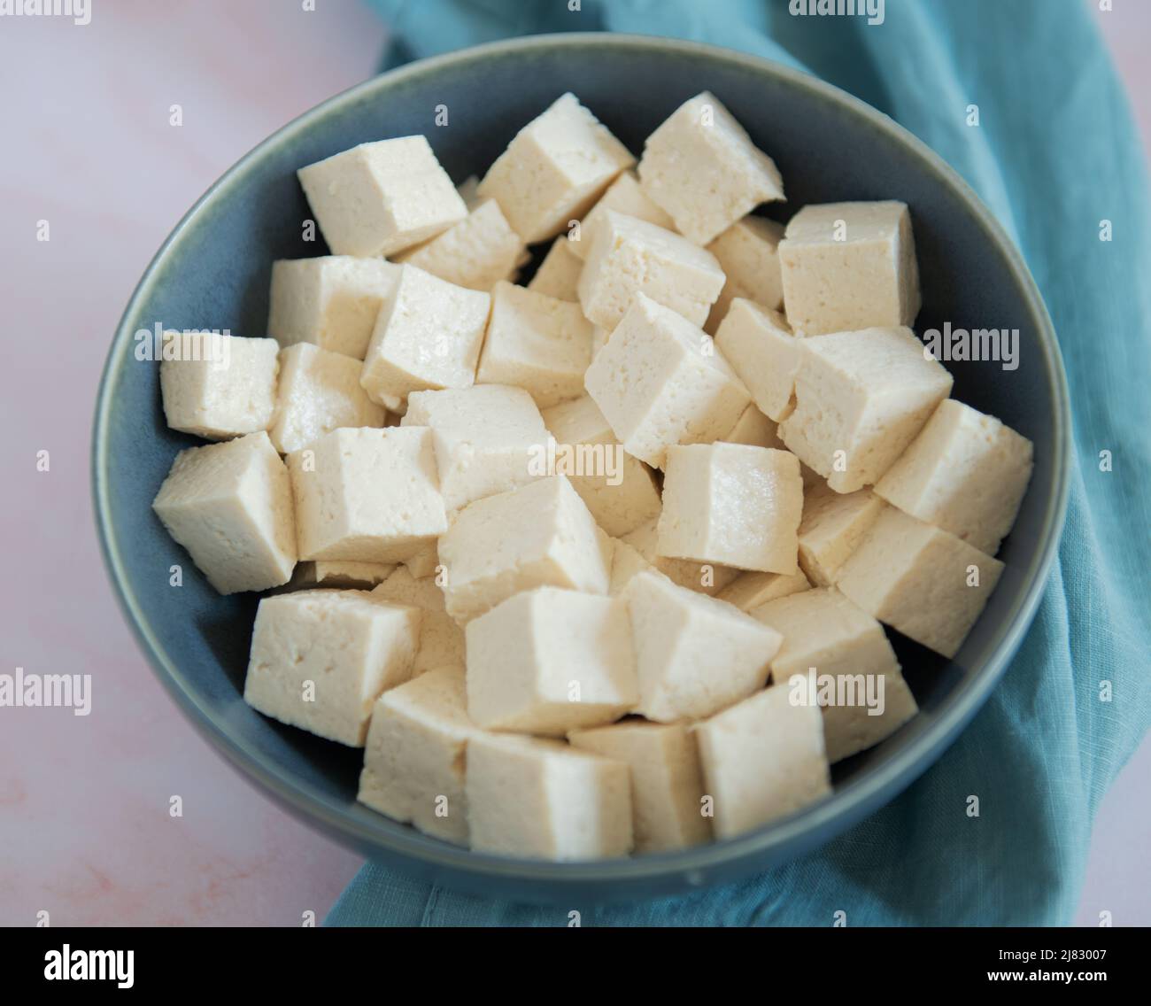 Bowl of raw tofu cut into cubes Stock Photo - Alamy