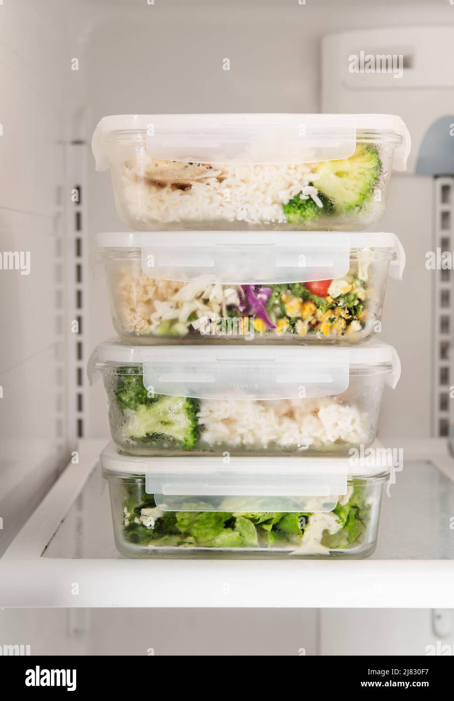 Meals/food prep containers sitting in the fridge Stock Photo